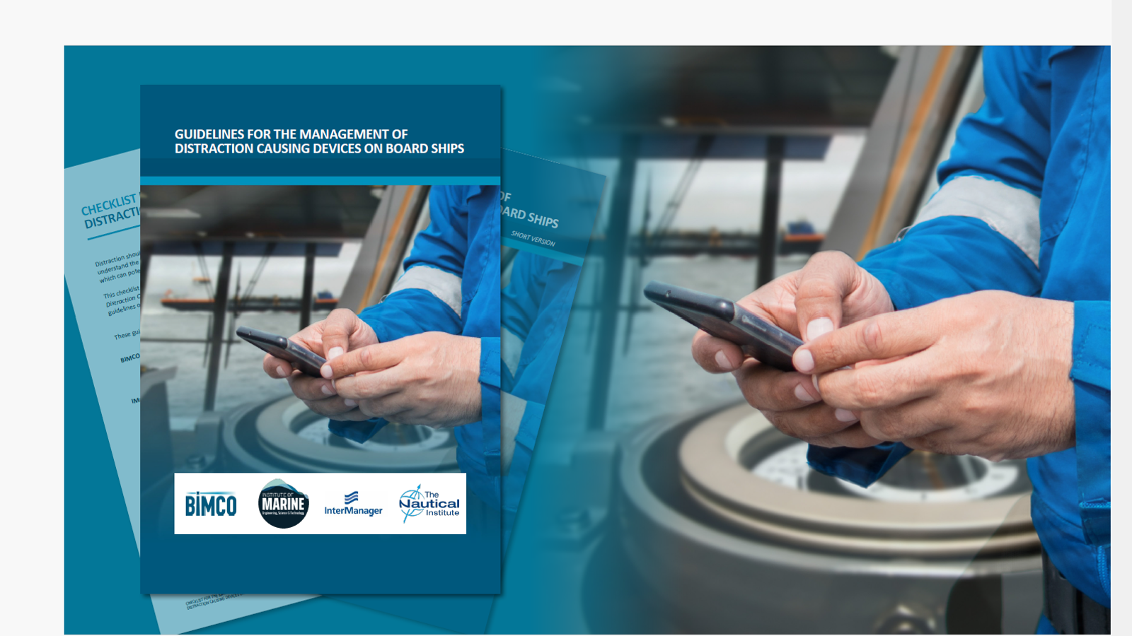 Seafarer holding mobile phone, with picture of front cover of 