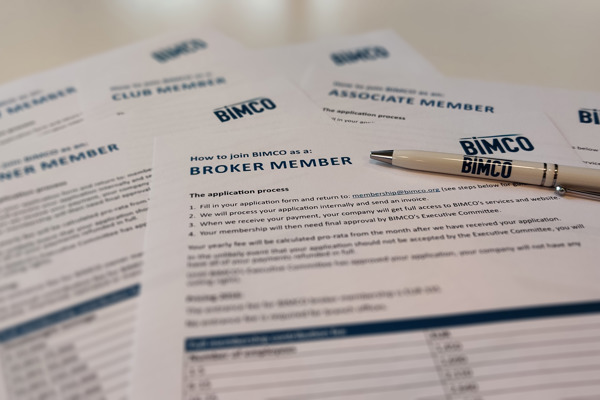 BIMCO applications forms with a pen on top of them