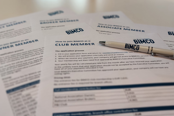 BIMCO applications forms with a pen on top of them