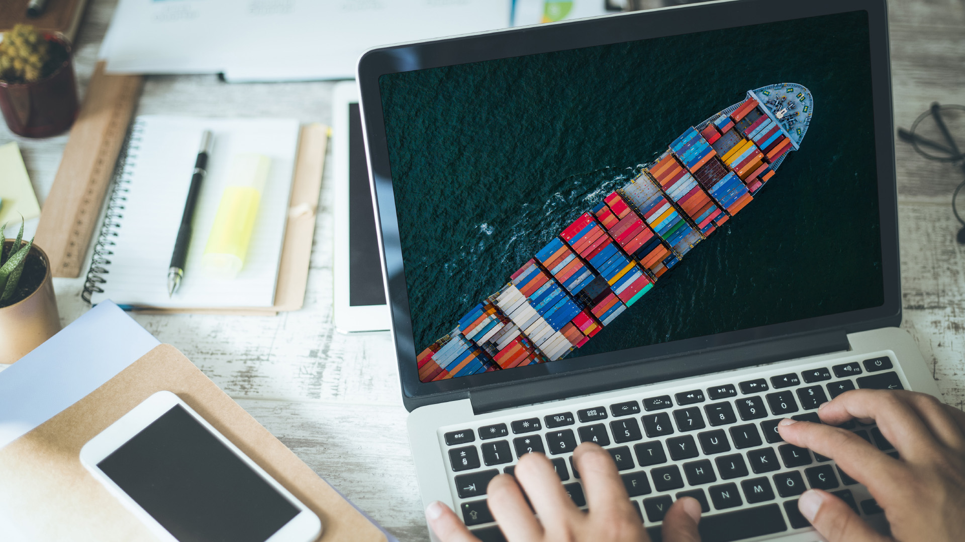 person typing on a laptop screen 