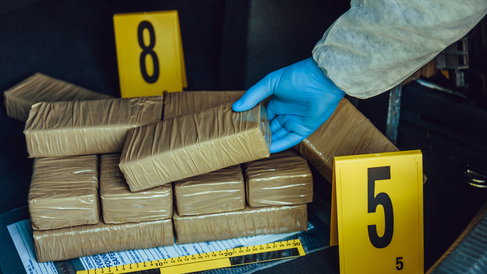 Packets of illegal drugs being inspected