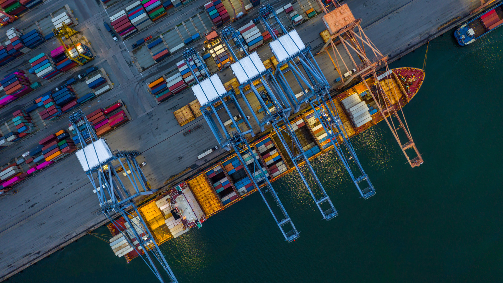 container ship being unloaded, viewed from above