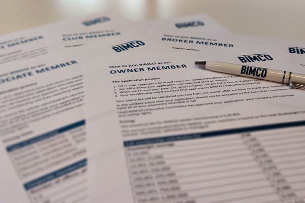 BIMCO applications forms with a pen on top of them