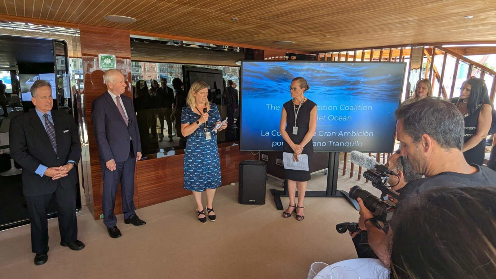 Bev Mackenzie of BIMCO and other panellists speaking in front of a screen with a presentation