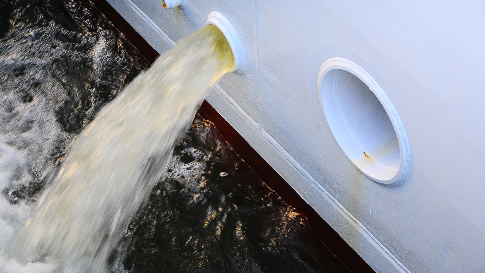 Water being pumped out of a ship